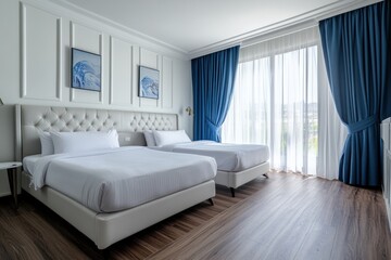A modern bedroom displaying two beds with matching white bedding