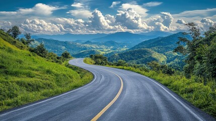 Naklejka premium Winding road through lush green hills under a bright blue sky with fluffy clouds. It can illustrate travel, freedom, adventure or a scenic route for vacation.