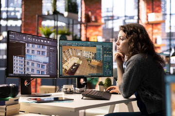Female employee at design agency creates 3D render of an apartment interior using architectural software. Employs computer aided tools to allow customization of furniture and flooring.