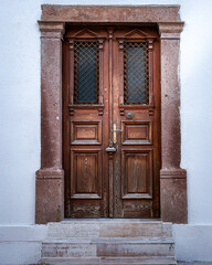 Rustic Wooden Double Doors with Stone Frame and Steps