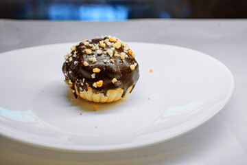 Chocolate Tartlet with Nuts on White Plate