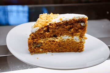 Classic Carrot Cake Slice with Walnuts and Cream Cheese Frosting