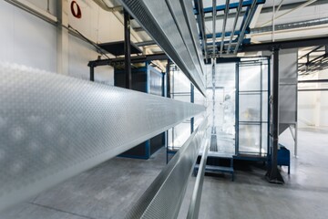 metal painting shop, parts ready for painting, perforated metal profiles