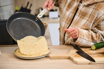 Making Homemade Crepes in a Cozy Home Kitchen Setting