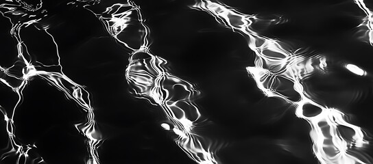 Abstract Black water surface texture natural ripple background. clear water wave texture on black background. Sunlight effect on surface of defocus blurred water. summer or spa concept