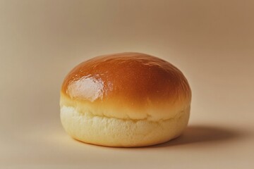 Freshly Baked Golden Brown Bun, Delicious Brioche Roll on Neutral Background - Close-Up