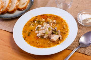 Rassolnik: popular Russian soup with pickled cucumbers, brine and pearl barley
