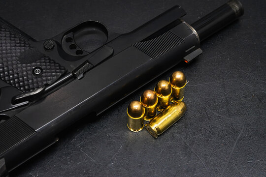 45 caliber pistol and cartridges. Self-defense weapon.