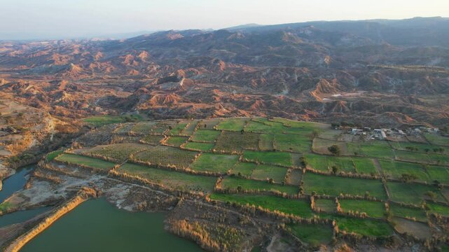 Aerial view of village between hills in Chakwal, Pakistan.