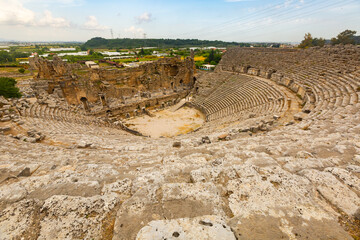 Remains of amphitheater, semicircular auditorium of Perge Theater. Pamphylian ancient city in...