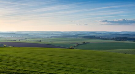A soft, peaceful hilltop with a panoramic view of green fields and distant mountains, Ai Generated