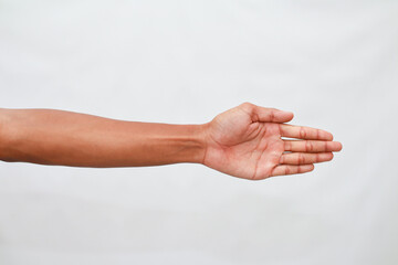 Outstretched Brown Hand Reaching On White Background Studio Shot