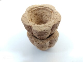 Sambrani is made from selected wood powder.  when burned it will create a very fragrant smell