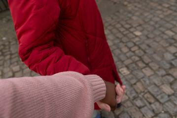 England United Kingdom. 09.03.2025. Carer and patient holding hands during a walk.