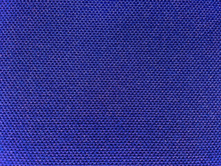 blue background rough surface fabric texture. porous woven fabric backpack bag