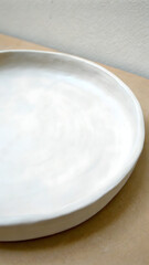 Empty ceramic plate a neutral table perfect fo