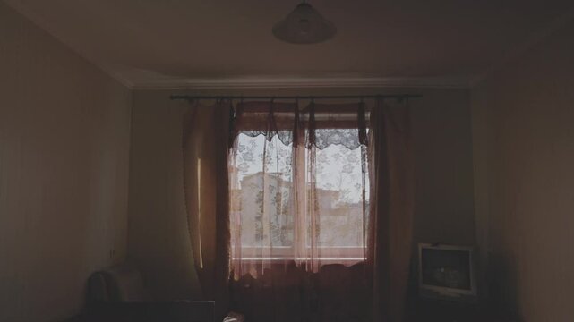 Soft sunlight gradually filtering through curtains, illuminating empty bedroom interior with warm, serene morning light and gentle architectural shadows