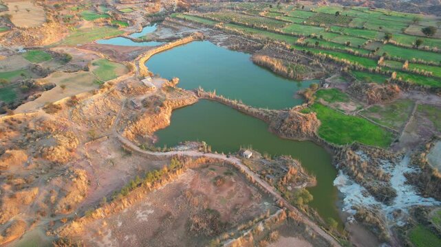 Aerial view of village between hills in Chakwal, Pakistan.