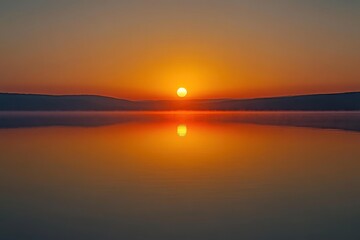 Obraz premium Serene Sunset Reflection Over Calm Water Landscape at Dusk