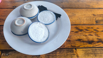 Coconut milk custard in small porcelain cup (Kanom Tuay), Thai dessert