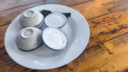 Coconut milk custard in small porcelain cup (Kanom Tuay), Thai dessert