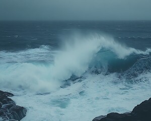 Fototapeta premium Ocean wave crashing on rocks with stormy weather