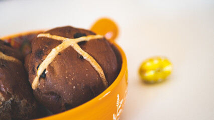 Hot cross buns with cup of tea easter holiday close up baking tasty delicious food 