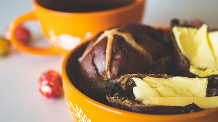 Hot cross buns with cup of tea easter holiday close up baking tasty delicious food 