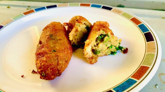 Cod dumplings, or "bolinhos de bacalhau", very famous in Portuguese gastronomy. Plate of bolinhos de bacalhau.