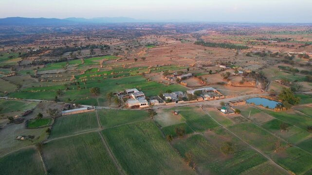 Aerial view of village between hills in Chakwal, Pakistan.