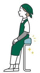 Obraz premium 座って働くスーパーの女性店員さん