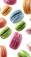 Assortment of colorful macarons falling on white background. Various pastel shades and chocolate filling visible. Delicious and sweet treat image.