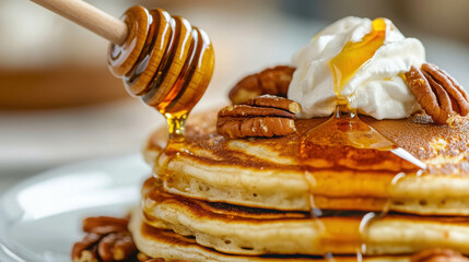 Delicious Stack of Pancakes Drizzled with Honey and Topped with Cream and Pecans