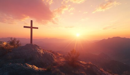 Obraz premium A wooden cross on a rocky mountain peak at sunset, with a vibrant sky of pink and orange clouds, overlooking a vast range of green mountains, warm golden lighting