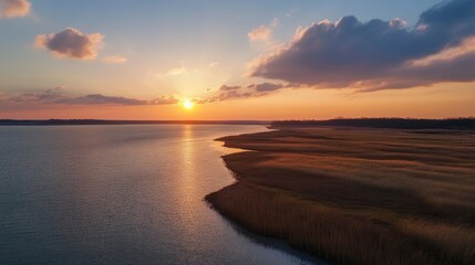 a scenic view of a sunset over a body of water.