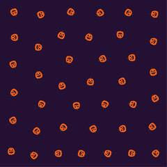 a pattern of pumpkins with faces on them