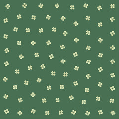 a green and white floral pattern with small flowers