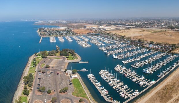 Aerial view of Chula Vista Marina filled with boats docked in rows, showcasing recreational boating and maritime activity in San Diego, California, USA.