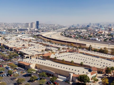 Tijuana, Mexico: Aerial view of the city showing the border wall separating Mexico from the United States. The photo shows the urban landscape. San Ysidro, San Diego, California, USA