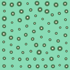a green background with a pattern of circles and flowers