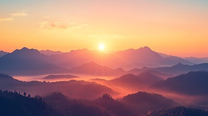 Fototapeta premium Breathtaking sunrise over misty mountains, creating a peaceful and serene atmosphere.