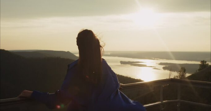 Woman enjoying sunset view from observation point