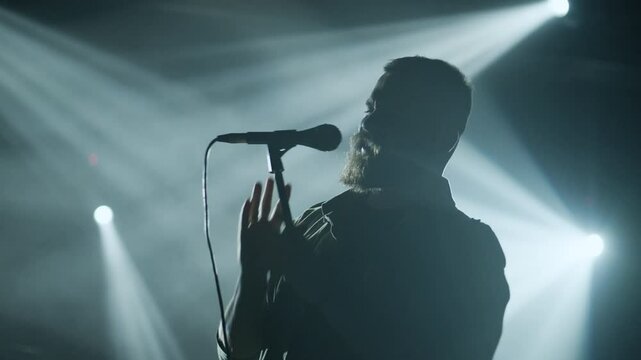 Singer performing live on stage in slow motion