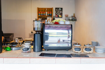 Coffee shop counter with espresso machine and cookie jars
