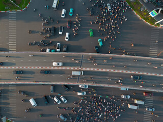 Aerial Top View close up of Chaotic Traffic at a Bustling Intersection in Ho Chi Minh City at...
