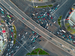 Aerial Top View of a Bustling Intersection in Ho Chi Minh City at Sunset with Chaotic Traffic - medium angle shot 
