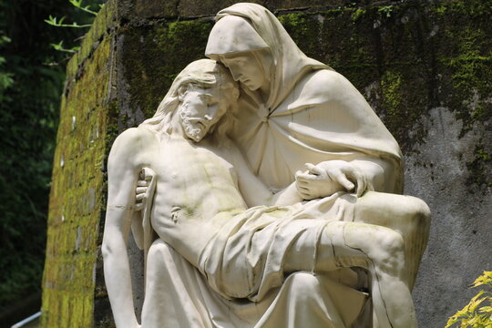 a statue of the Virgin Mary carrying Jesus at a religious tourist spot in Java