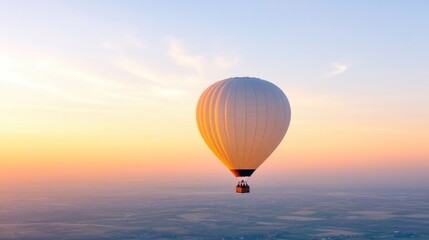 Obraz premium A serene hot air balloon floats above a golden sunrise
