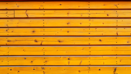 Vibrant yellow painted wood planks, horizontal lines, rustic texture, natural wood grain, building exterior.