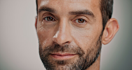 Portrait, skincare and man in studio for natural beauty, beard and facial treatment isolated on...